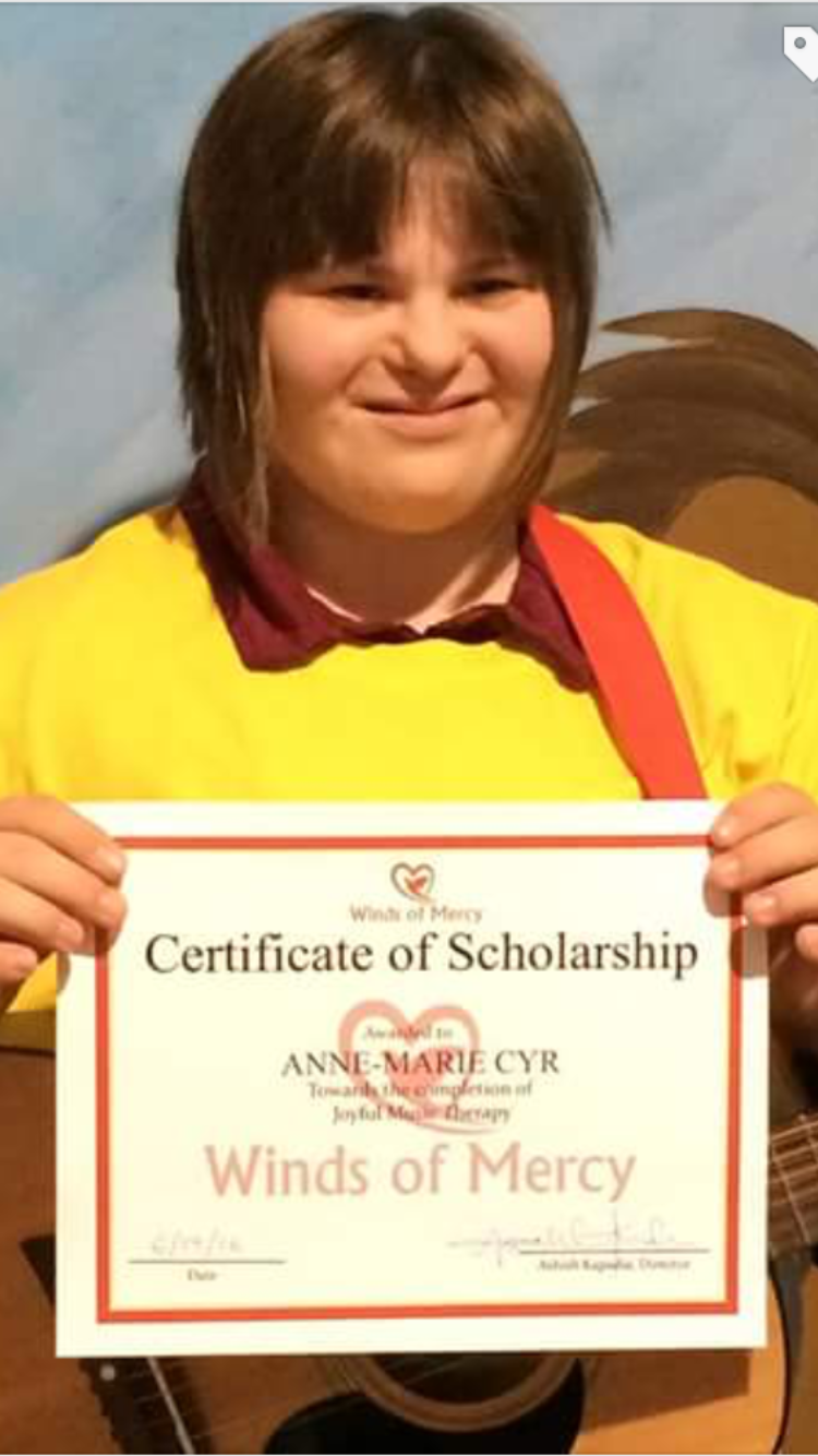 Anne-Marie Cyr is happy to receive her scholarship for Joyful Music.